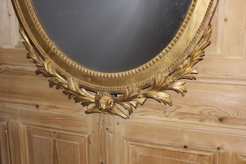 Miroirs, Trumeaux  - Miroir en bois doré et sculpté Louis XVI