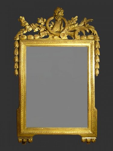 Miroirs, Trumeaux  - Miroir en bois doré et sculpté d'époque Louis XVI