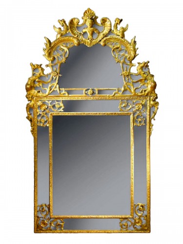 Miroir à parecloses en bois sculpté et doré d'époque Régence