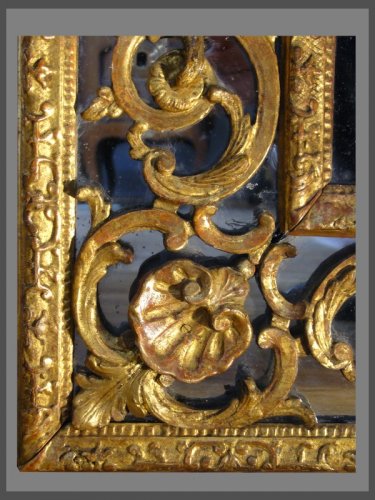 Miroir à parecloses en bois sculpté et doré d'époque Régence - Régence