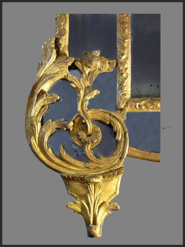 Miroir en bois sculpté et doré d'époque Régence - Antiquités Rigot et Fils