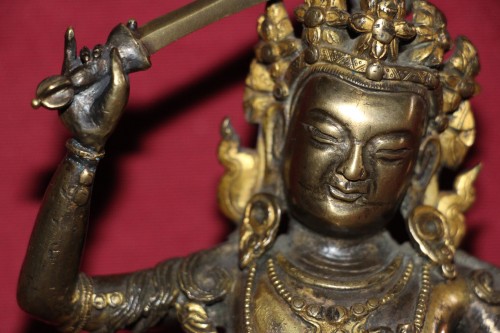 XVIIe siècle - Bouddha de la sagesse avec épée Manjushri en bronze doré, Tibet, fin XVIIe.