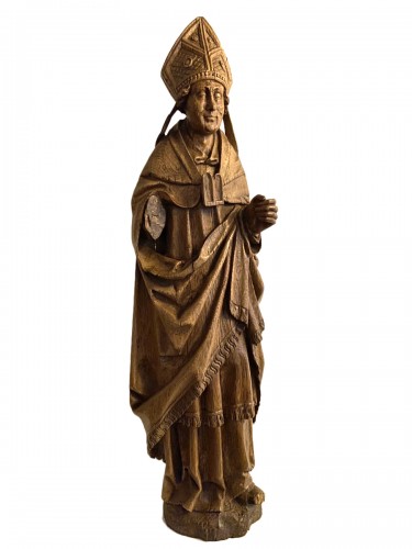 Un évêque sculpté très détaillé en chêne - flamand ou français - 16e siècle
