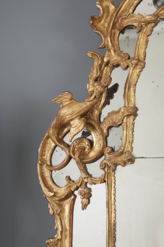 Miroir d’époque Régence en bois doré aux chimères - Régence