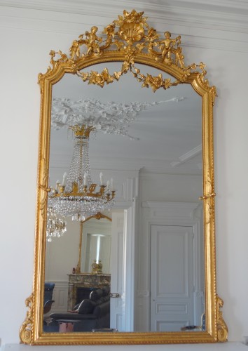 XIXe siècle - Grand miroir de cheminée en bois doré, glace au mercure