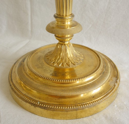 Antiquités - Paire de flambeaux en bronze doré fin 18e début 19e siècle