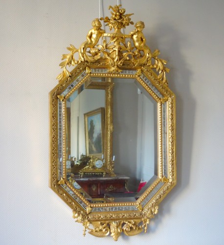 Miroirs, Trumeaux  - Miroir Napoléon III en bois doré et à parecloses