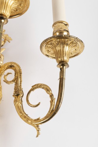 Antiquités - Ensemble de quatre grandes appliques Epoque Louis XVI en bronze doré