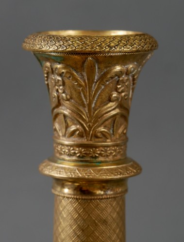 XIXe siècle - Quatre bougeoirs Charles X en bronze doré