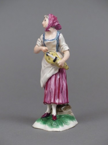 Antiquités - Joueuse de vielle à roue, en faïence de Niderviller, XVIIIe siècle