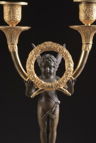 Luminaires Bougeoirs et Chandeliers - Paire de candélabres Empire en bronze doré et patiné