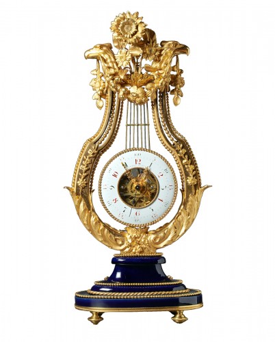 Pendule lyre squelettée en bronze doré et porcelaine de Sèvres