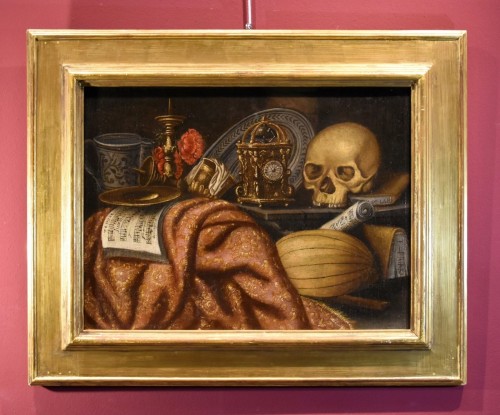 Antiquités - Vanitas au tapis, horloge, partition et crâne, école italienne du 17e siècle