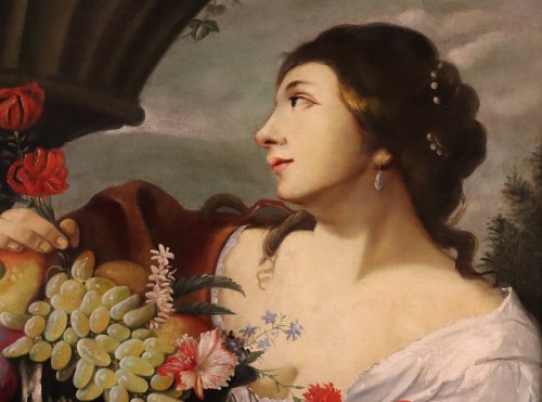 Antiquités - Femme avec des fleurs et des fruits, atelier d'Abraham Brueghel (1631 - 1690)