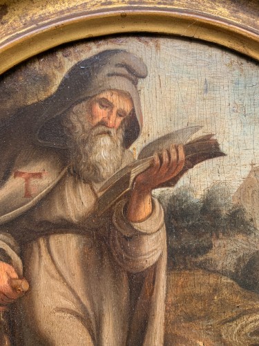 St. Anthony Abbot with pig in a Flemish landscape with church. XVIIth cent - 