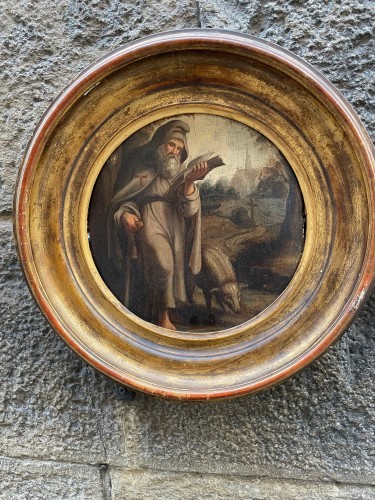 Antiquités - St. Anthony Abbot with pig in a Flemish landscape with church. XVIIth cent