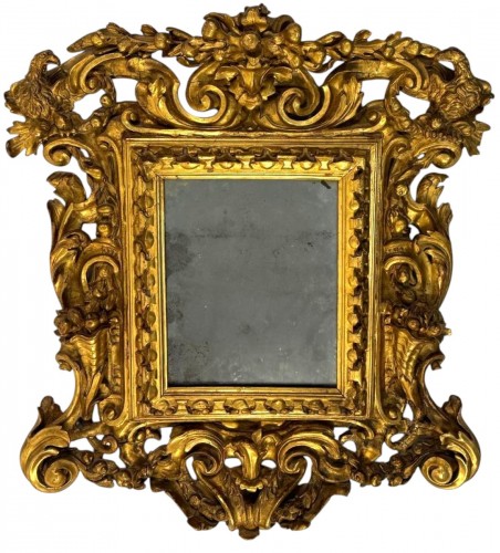 Carved, engraved and gilded wooden mirror, Tuscany early 18th century
