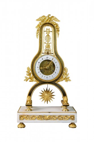 A Louis XVI Lyre Clock with skeleton movement