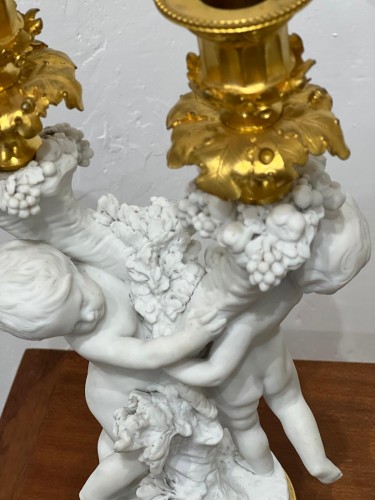 Antiquités - Paire de bougeoirs en porcelaine de Sèvres en biscuit et bronze doré fin XIXe siècle