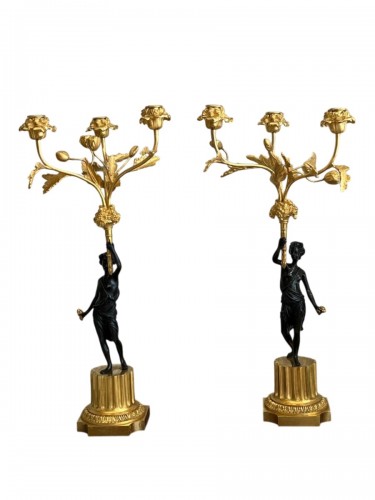 Pair of patinated and gilt bronze candelabra, early 19th century