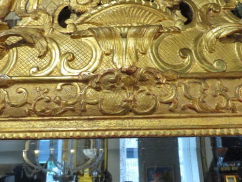 Grand miroir Régence en bois sculpté et doré - Régence
