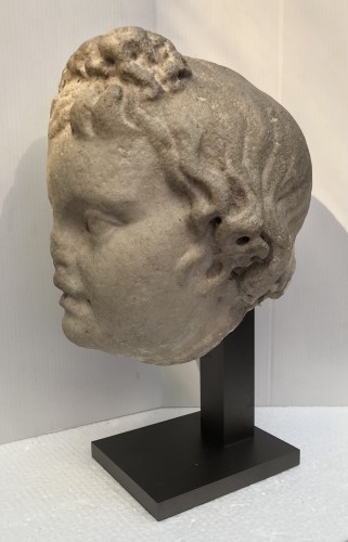 Archéologie  - Tête d'Eros en marbre d'époque Romaine