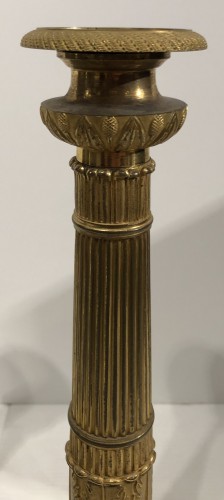 Paire de bougeoirs 1er Empire en bronze dorée - 
