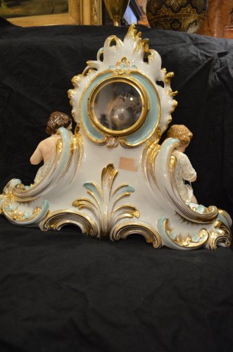 Antiquités - Pendule en porcelaine de Paris