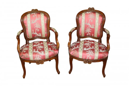 Pair of Lyonnais walnut armchairs, Transition period