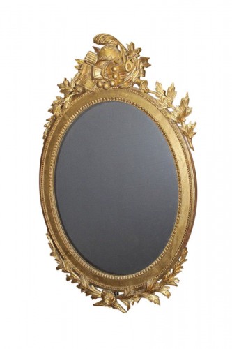 Miroir en bois doré et sculpté Louis XVI