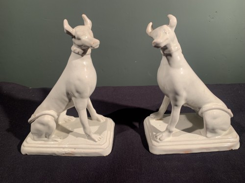 Two greyhounds, male and female, forming a pendant. White earthenware from  - Porcelain & Faience Style Directoire