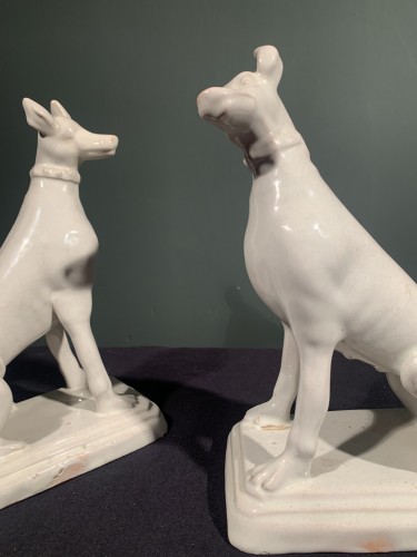 Directoire - Two greyhounds, male and female, forming a pendant. White earthenware from 