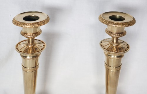 Antiquités - Paire de bougeoirs Empire en bronze doré