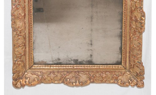 XVIIIe siècle - Miroir en bois sculpté et doré Époque Régence