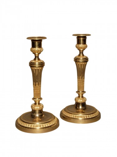 Pair of Louis XVI period gilt candlesticks 