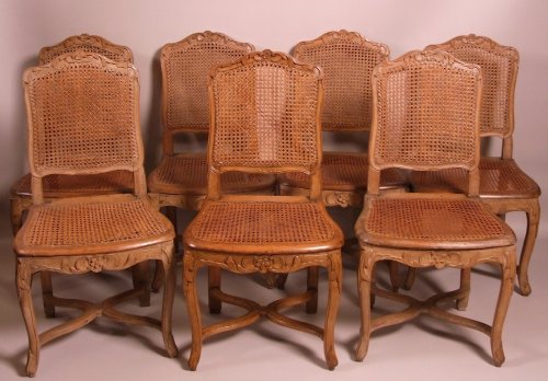 Suite of seven Regence caned chairs stamped by Amand