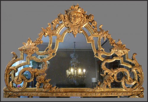 Miroir en bois sculpté et doré d'époque fin Louis XIV - début Régence - Régence