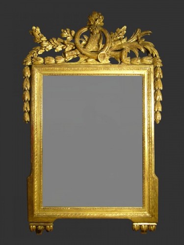 Miroir en bois doré et sculpté d'époque Louis XVI