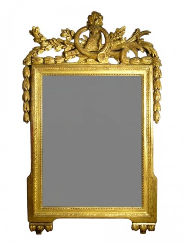 Miroir en bois doré et sculpté d'époque Louis XVI