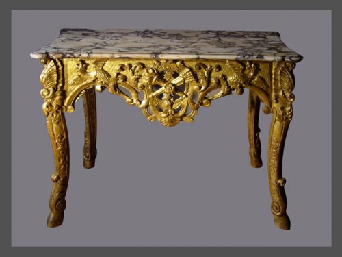 Carved giltwood console table of Regence period