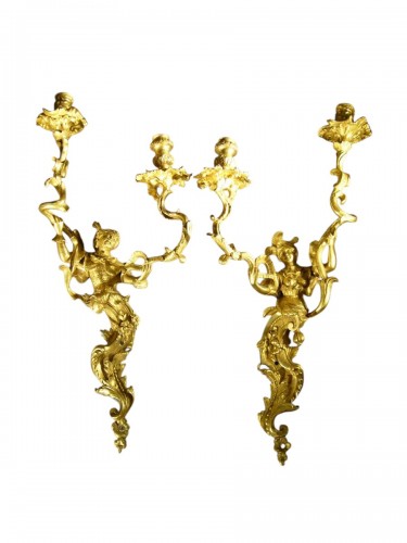 A pair of Regence ormolu two-branch firgural wall-lights