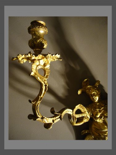 A pair of Regence ormolu two-branch firgural wall-lights - 