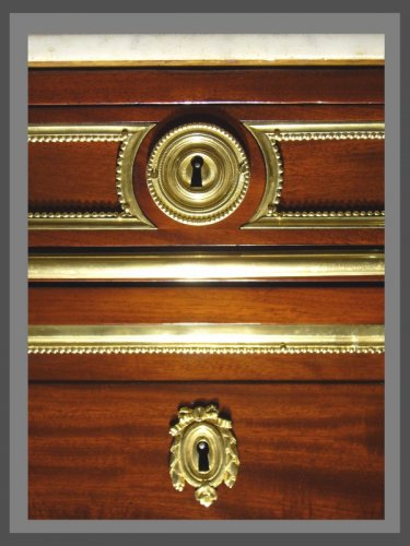 A Louis XVI ormolu-mounted mahogany commode - 