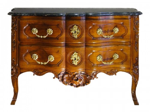 An exceptional crossbow shaped solid blond walnut commode.