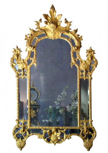 Miroir en bois sculpté et doré et parcloses de glaces