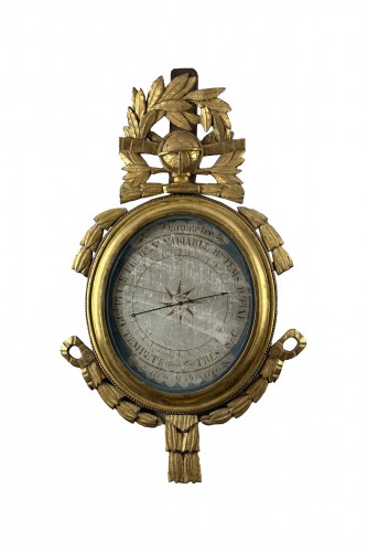 A Louis XVI giltwood barometer with scientific attributes