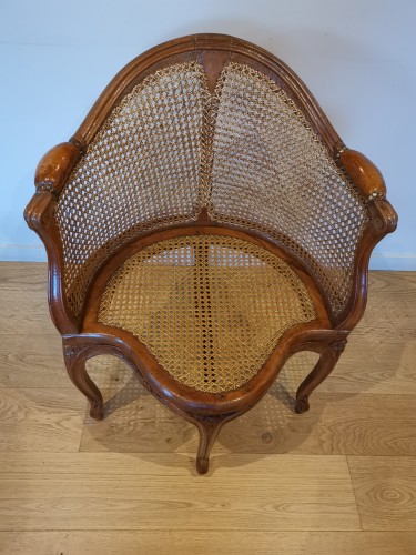 Antiquités - Fauteuil de bureau canné d’époque Louis XV