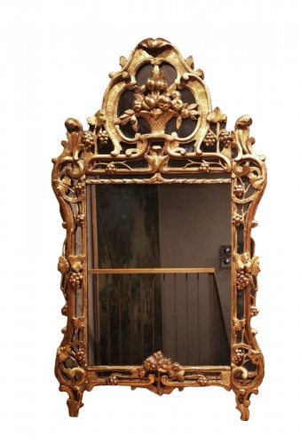 A Louis XV giltwood mirror from Provence