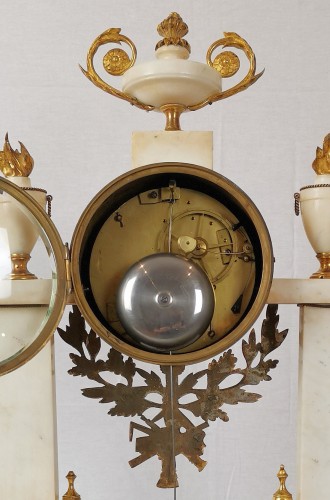 A Louis XVI portico marble and gilt-bronze mantel clock. - 