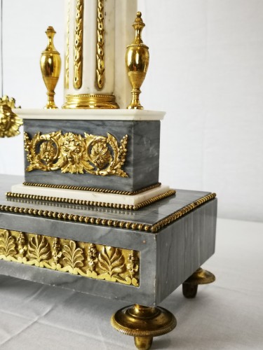 Louis XVI - A Louis XVI portico marble and gilt-bronze mantel clock.